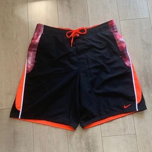 Nike- men’s size large swim trunks Black orange and plaid like new condi…